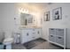 Charming bathroom with double sinks and decorative art prints at 2984 Sanctuary Dr, Clermont, FL 34714
