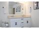 Bathroom featuring a double sink vanity with black hardware and neutral wall decor for an elevated feel at 2984 Sanctuary Dr, Clermont, FL 34714