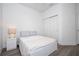 Clean bedroom with ample storage in the large closet, soft gray wood flooring, and modern decor at 2984 Sanctuary Dr, Clermont, FL 34714