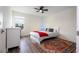 Cozy bedroom featuring a ceiling fan, a plush bed, and a window with a view at 2984 Sanctuary Dr, Clermont, FL 34714