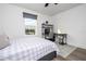Bright bedroom with a window, complemented by a comfortable bed and functional desk at 2984 Sanctuary Dr, Clermont, FL 34714