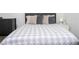 The bedroom is bright and inviting, featuring a comfortable bed with soft pillows and bedding at 2984 Sanctuary Dr, Clermont, FL 34714