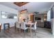Inviting dining room with modern light fixture and stylish decor adjacent to living area at 2984 Sanctuary Dr, Clermont, FL 34714