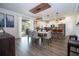 Dining area with a modern light fixture, a dining table for six, and views of the kitchen at 2984 Sanctuary Dr, Clermont, FL 34714