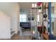Inviting foyer with a decorative shelf, hardwood floors, and modern decor create a warm and welcoming atmosphere at 2984 Sanctuary Dr, Clermont, FL 34714