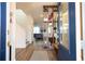Inviting foyer with a decorative shelf, hardwood floors, and modern decor create a warm and welcoming atmosphere at 2984 Sanctuary Dr, Clermont, FL 34714