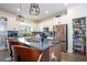 Open kitchen with granite countertops, stainless steel appliances, and a walk-in pantry at 2984 Sanctuary Dr, Clermont, FL 34714