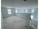 Bright and airy bonus room with multiple windows allowing ample natural light, offering potential for various uses at 30113 Misty Pines Rd, Mount Dora, FL 32757