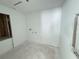 An unfinished laundry room with white walls and visible electrical and plumbing connections ready for customization at 30113 Misty Pines Rd, Mount Dora, FL 32757