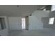 Open floor plan living room with tall ceilings and stairs to the second floor at 30113 Misty Pines Rd, Mount Dora, FL 32757