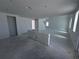 Open floor plan living room featuring bright light, tall ceilings and connections for appliances at 30113 Misty Pines Rd, Mount Dora, FL 32757