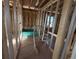 Bathroom space framed with tub and plumbing, ready for finishing touches at 30158 Rustic Mill St, Mount Dora, FL 32757