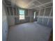 Bright bedroom featuring a window with neighborhood views and ready to customize at 30158 Rustic Mill St, Mount Dora, FL 32757