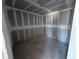 Unfinished closet with grey walls and flooring ready for new owner's customizations at 30158 Rustic Mill St, Mount Dora, FL 32757