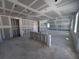 Under-construction interior view featuring open spaces, drywall, lighting and electrical work in progress at 30158 Rustic Mill St, Mount Dora, FL 32757
