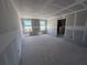 Spacious living room with a doorway that provides ample room for furniture and entertaining at 30158 Rustic Mill St, Mount Dora, FL 32757