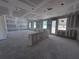 Large unfinished room, featuring drywall, windows, and natural light, open floor plan concept at 30158 Rustic Mill St, Mount Dora, FL 32757