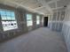 Spacious living room with large windows providing great neighborhood views and natural light at 30158 Rustic Mill St, Mount Dora, FL 32757