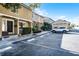 Townhome exterior with dedicated parking spaces and landscaped greenery at 311 W Lake Faith Dr, Maitland, FL 32751