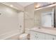 Clean bathroom with a shower-tub combo, a vanity with sink, and a white toilet at 322 E Central Blvd # 1910, Orlando, FL 32801