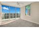 Bright bedroom with ceiling fan, carpet, and a large window offering a great view at 322 E Central Blvd # 1910, Orlando, FL 32801