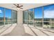 Bright, spacious bedroom with floor-to-ceiling windows offering panoramic city views, and a ceiling fan at 322 E Central Blvd # 1910, Orlando, FL 32801