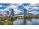 Scenic view of the city skyline reflecting in a tranquil lake, highlighting nearby community at 322 E Central Blvd # 1910, Orlando, FL 32801
