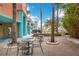 Outdoor courtyard area with seating, mature trees, and views of the city skyline at 322 E Central Blvd # 1910, Orlando, FL 32801