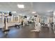 Well-equipped gym featuring weight machines, flat-screen televisions, and plenty of natural light at 322 E Central Blvd # 1910, Orlando, FL 32801