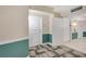 Hallway leading to condo unit with neutral walls and colorful lower panel at 322 E Central Blvd # 1910, Orlando, FL 32801