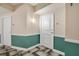Hallway leading to condo unit with neutral walls and colorful lower panel at 322 E Central Blvd # 1910, Orlando, FL 32801
