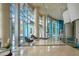 The building lobby features tile floors, large columns, and floor to ceiling windows at 322 E Central Blvd # 1910, Orlando, FL 32801