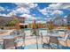Inviting pool deck with tables, seating, and views of the city skyline at 322 E Central Blvd # 1910, Orlando, FL 32801