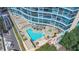 A beautiful condominium with a refreshing pool, lounge chairs, landscaping, and inviting spa at 322 E Central Blvd # 1910, Orlando, FL 32801