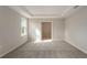 Bright bedroom with tray ceiling, carpet floors, and a window at 3230 Viceroy Ct, Poinciana, FL 34759