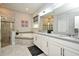 Bathroom featuring a glass-enclosed shower and a relaxing soaking tub at 3237 Palatka St, Orlando, FL 32824