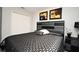 A primary bedroom with a stylish bed, contemporary decor, and a double door closet at 3237 Palatka St, Orlando, FL 32824