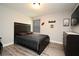 Comfortable bedroom with a wall-mounted TV and sports decor at 3237 Palatka St, Orlando, FL 32824