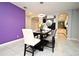 Charming dining area with a modern light fixture, stylish chairs, and seamless flow into adjacent kitchen at 3237 Palatka St, Orlando, FL 32824
