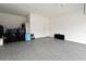Spacious garage with epoxy flooring, providing a clean and durable surface for vehicles and storage at 3237 Palatka St, Orlando, FL 32824