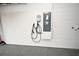 This garage features an electric vehicle charging station and a durable, speckled floor at 3237 Palatka St, Orlando, FL 32824