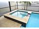 Close-up of in-pool spa, tiled and integrated with the pool, perfect for relaxation at 3237 Palatka St, Orlando, FL 32824