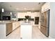 Bright kitchen with stainless steel appliances, white cabinetry, gray countertops, and center island at 3237 Palatka St, Orlando, FL 32824