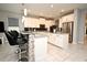 Modern kitchen features white cabinets, stainless steel appliances, and stone accent bar with seating at 3237 Palatka St, Orlando, FL 32824