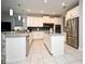 Bright kitchen with stainless steel appliances, white cabinetry, gray countertops, and tiled backsplash at 3237 Palatka St, Orlando, FL 32824