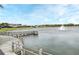 Scenic lake view with a fountain and wooden pier, enhancing the community's natural beauty at 3237 Palatka St, Orlando, FL 32824