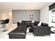 Stylish living room with textured wall, black leather sectional, and bar seating at 3237 Palatka St, Orlando, FL 32824