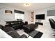 Modern living room features leather sectional, contemporary decor, and natural light at 3237 Palatka St, Orlando, FL 32824