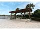 Community pergola with stone benches, providing a relaxing outdoor space with lake views at 3237 Palatka St, Orlando, FL 32824