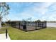 Lakefront playground with swings, climbing ropes, and benches at 3237 Palatka St, Orlando, FL 32824